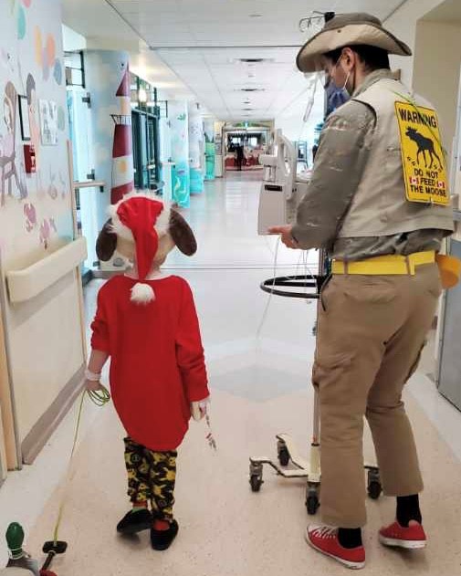 Liam and staff member at Sick Kids Toronto